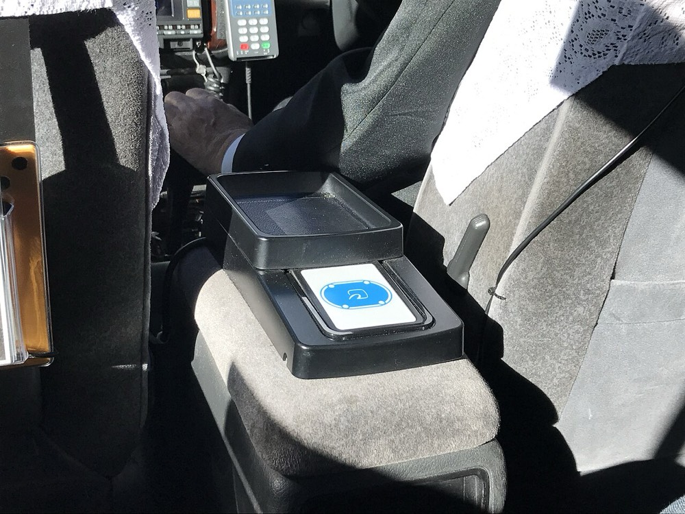 An IC card reader inside a taxi