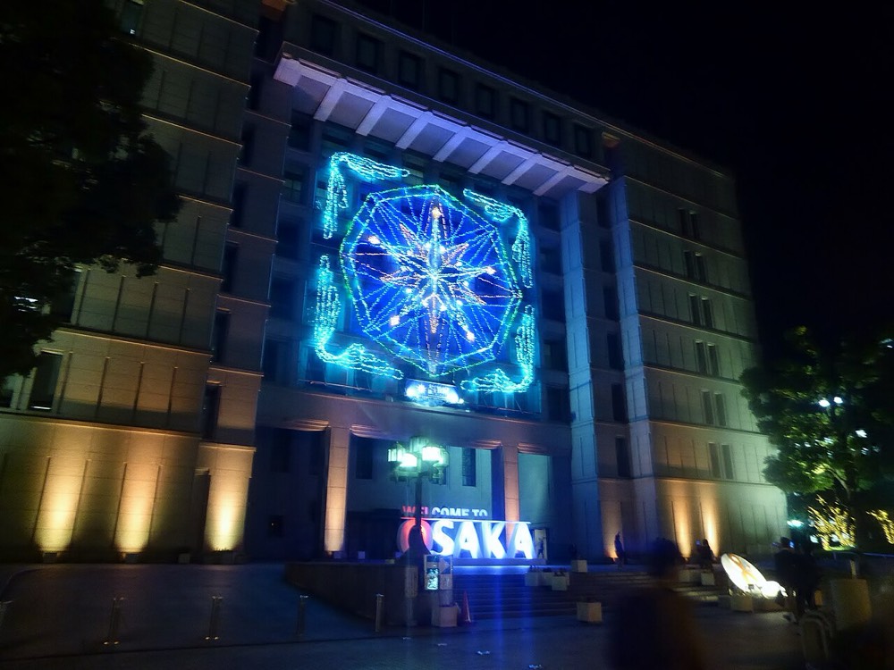 Light projections on building facades along an Osaka street during the Midosuji Illumination