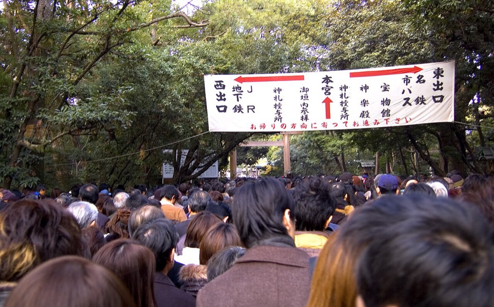 Crowds filling the grounds of a shrine at New Year