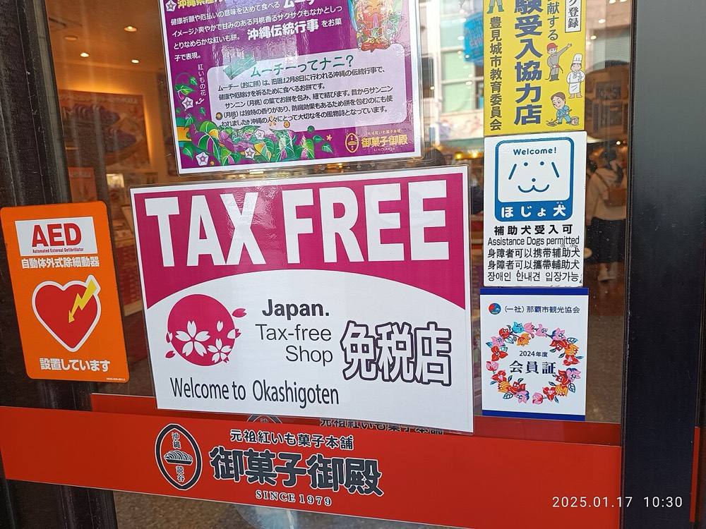 A tax-free shop sign and notice on a shop's glass door