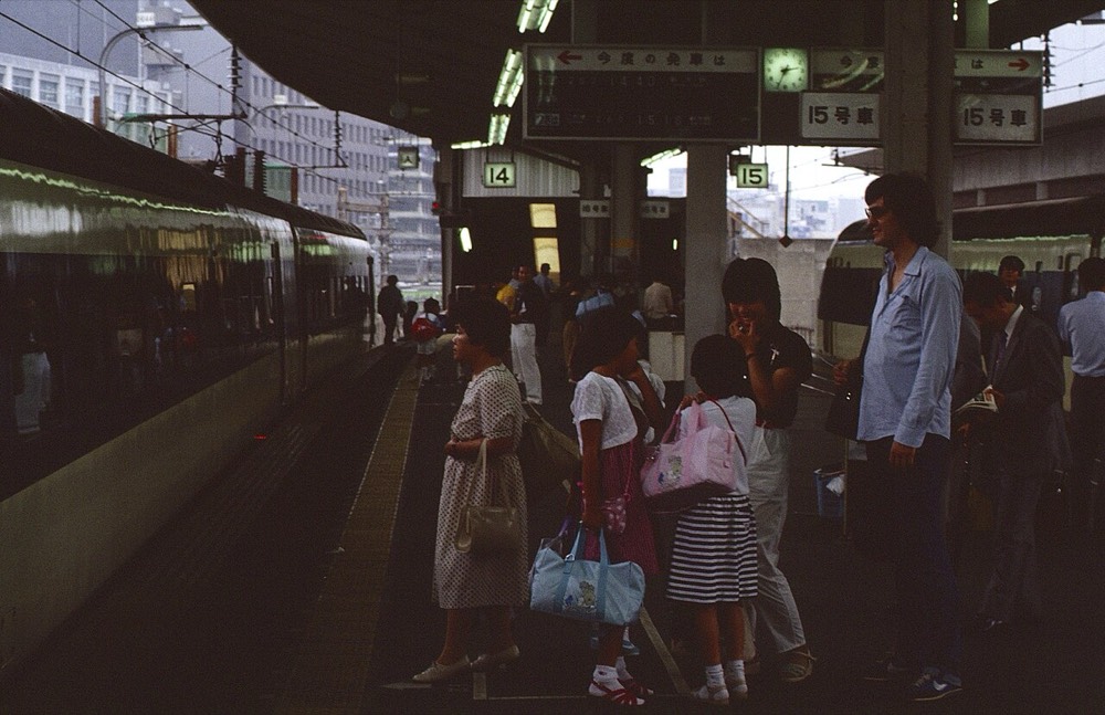 Passengers queuing at marked spots on a Shinkansen platform at Tokyo Station