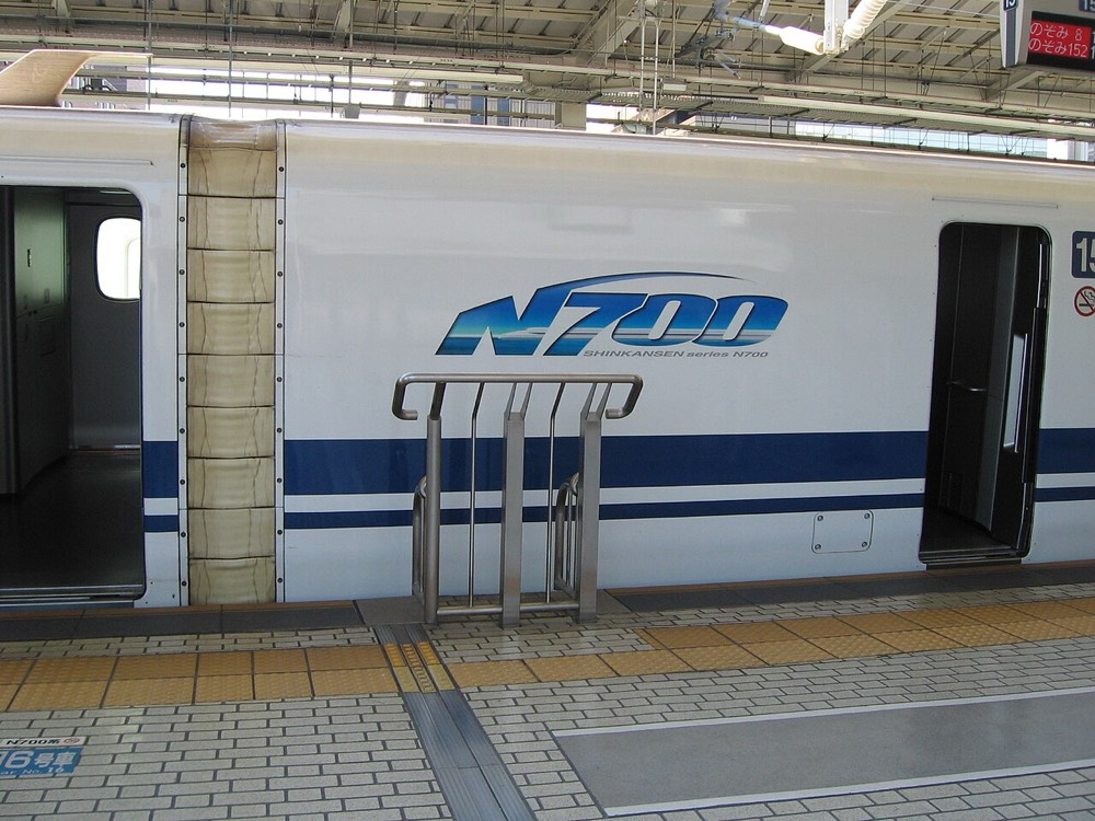 An N700 series NOZOMI Shinkansen stopped at the platform