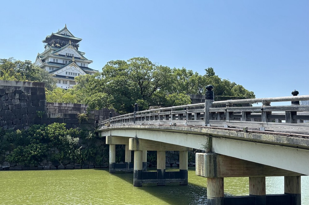 Gokurakubashi Bridge over the moat with Osaka Castle Main Tower behind