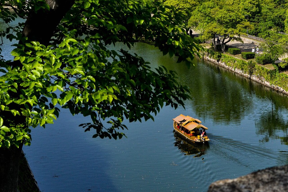 A goza-bune boat carrying visitors on the Osaka Castle moat