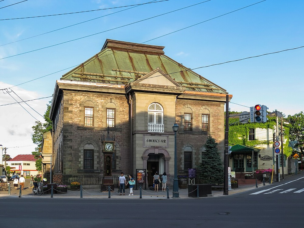 The Otaru Music Box Museum Main Building on Sakaimachi Street, a stone building with a green copper roof