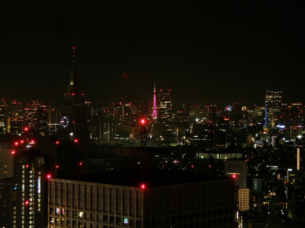 Tokyo's night view from the Tokyo Metropolitan Government Building Observatory, with Tokyo Tower in the distance