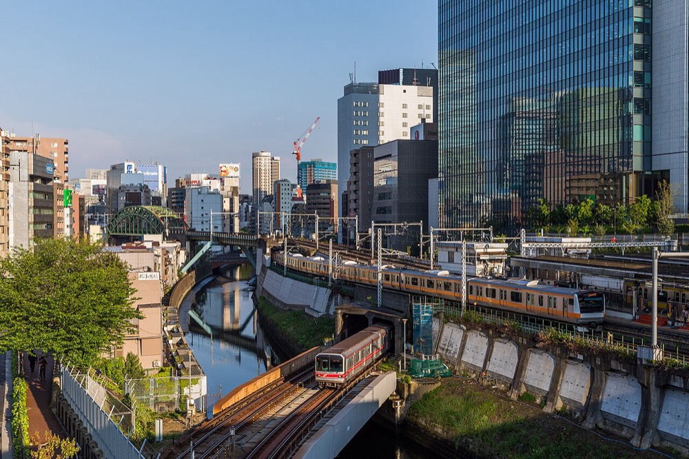 Tokyo Metro and JR East trains crossing over the Kanda River near Ochanomizu