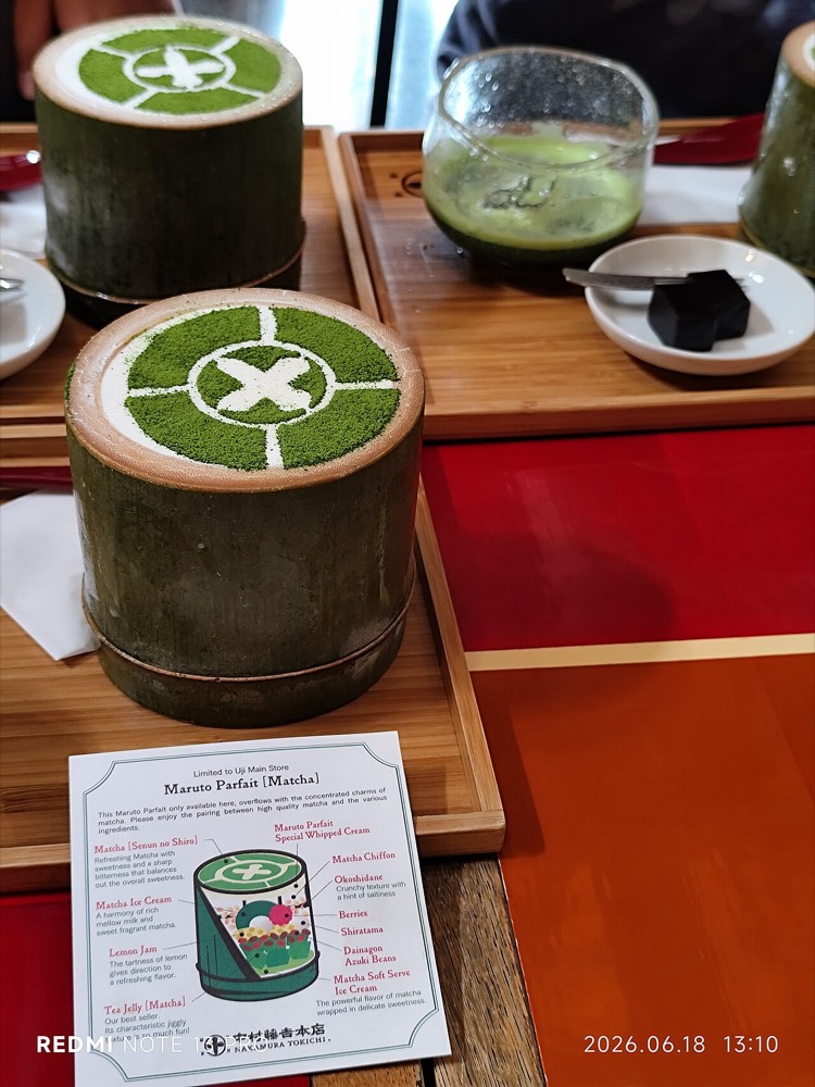 Matcha dessert served in a bamboo tube with tea utensils